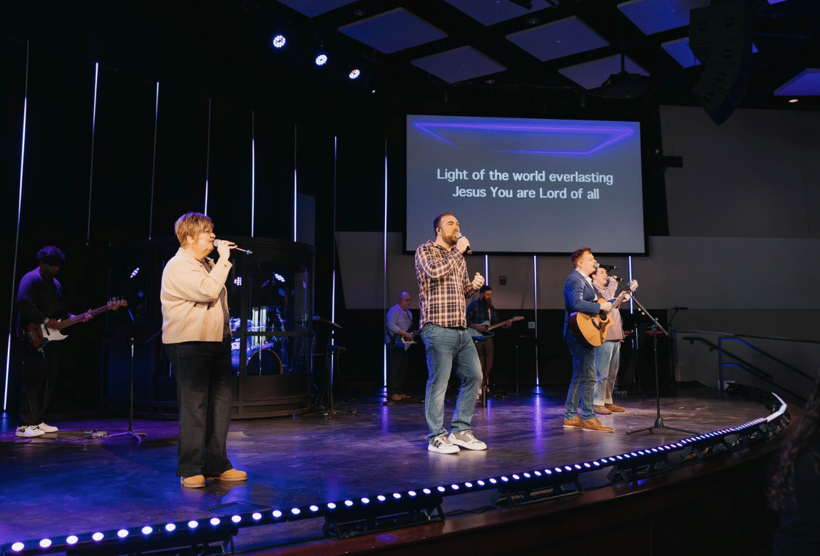 Three people talking at church