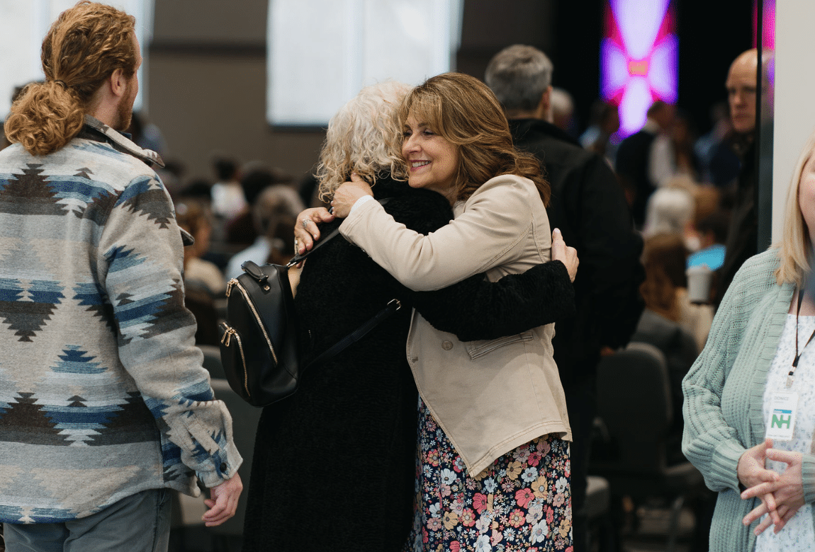 Three people talking at church